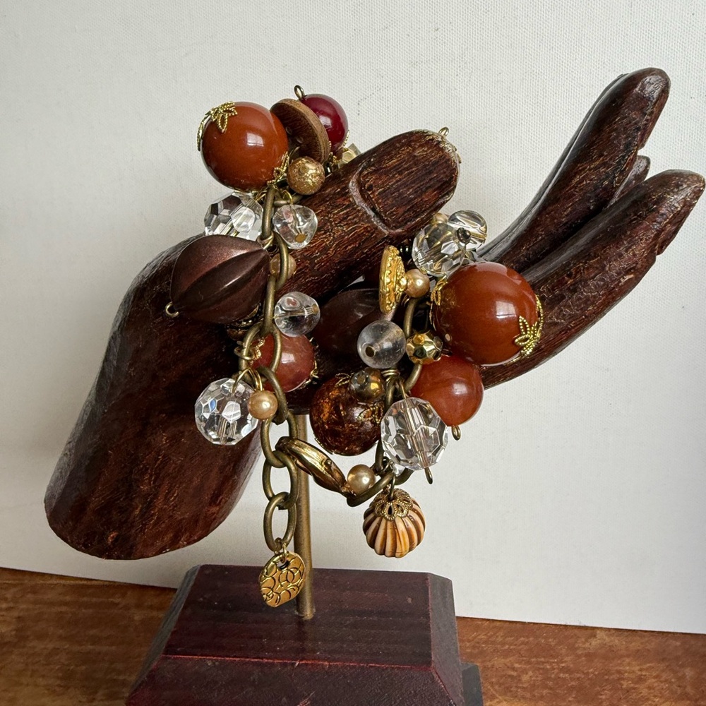 Vintage Chic Gold and Brown Charm Bracelet with Intricate Design